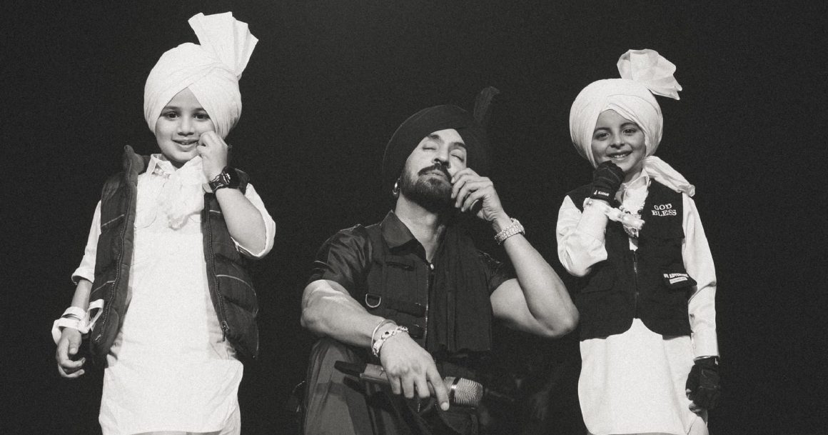 Diljit Dosanjh performing during the Dil-Luminati Tour, which generated ₹943 crore across 14 shows with over 3.2 lakh tickets sold.