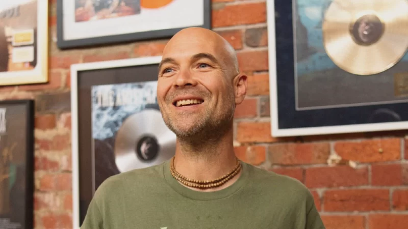 Caleb Williams of Unified Music Group discusses managing kirtan artists and heavy bands, focusing on touring, success metrics, and mental health.