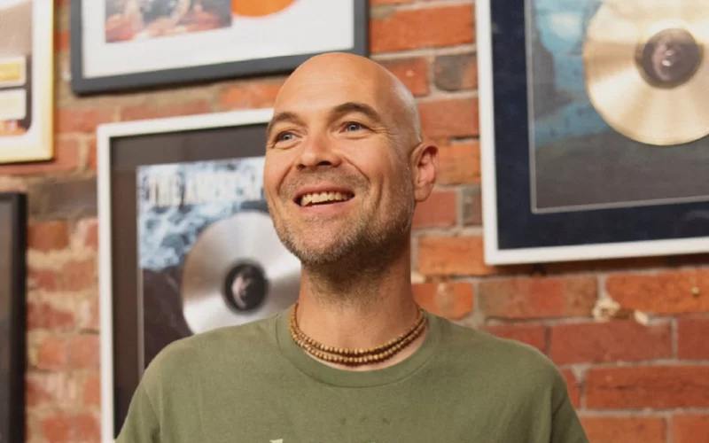 Caleb Williams of Unified Music Group discusses managing kirtan artists and heavy bands, focusing on touring, success metrics, and mental health.